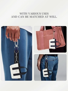 Mini ciondolo in tela bianca con chiusura in metallo per borse e passanti jeans