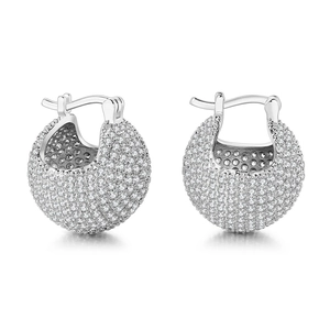 Macro detail of silver dome hoop earrings featuring full pavé set cubic zirconia stones
