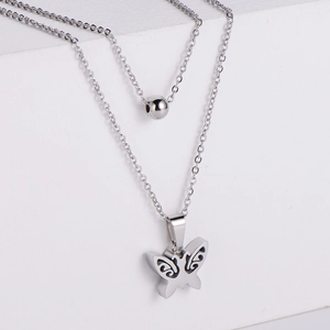 Double-layered silver titanium steel necklace with hollow butterfly pendant and round beads