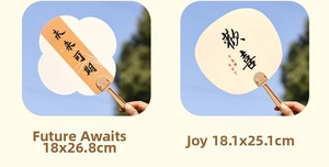 Detail of traditional Chinese hand fans with calligraphy and floral patterns in nature