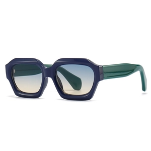 Gafas de sol geométricas de montura gruesa con bloque de color azul-verde y lentes degradadas