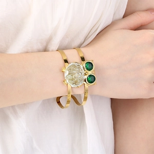 Golden owl cuff bracelet with green crystal eyes for women in stainless steel