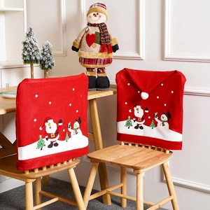 Red non-woven Christmas chair covers featuring Santa Claus and snowman festive patterns