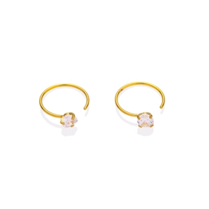 Macro detail of 316L gold-plated earrings with sparkling white round-cut zircon stones