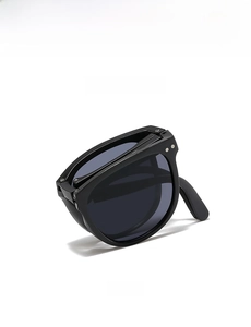 Lunettes de soleil pliables pour enfants avec monture noire et verres gris, vue latérale