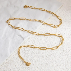 Close-up of 18k gold-plated stainless steel paperclip chain with heart pendant and engraving