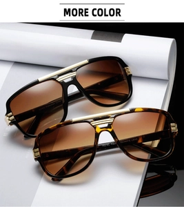 Detail of pilot sunglasses with double gold metal bridge and UV400 gradient lenses