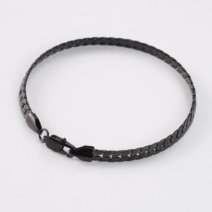 Detailed view of the black metal flat chain bracelet with a secure lobster clasp