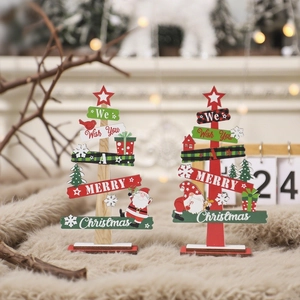 Mini wooden Christmas tree tabletop decorations with festive greetings and snowflake motifs