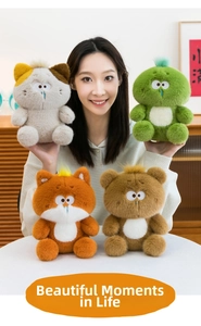 Detail of four plush toys featuring soft long-pile fabric and blue teardrop accents