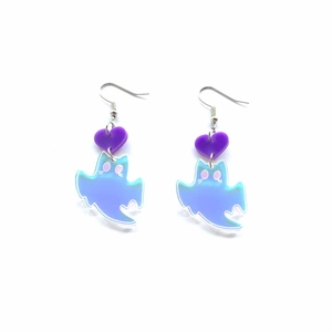 Detailed macro shot of purple heart acrylic earrings with iridescent ghost charms