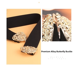 Close-up of golden hollow butterfly buckle on a black elastic waist belt for dresses