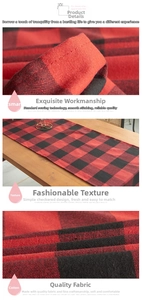 Detail of red and black buffalo check table runner showing stitching and cotton fabric texture