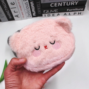 Pink plush cartoon bear pouch with cute embroidery held in hand for small items