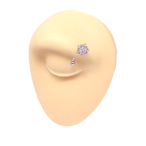 Detail of flower belly button ring with pink and clear crystals on medical steel bar