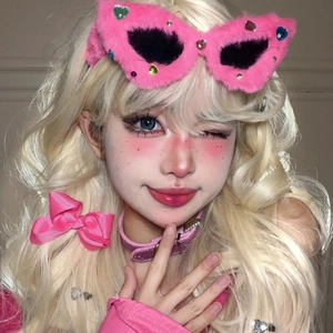 Pink plush cat-eye sunglasses and bow hairclip in Y2K style for fashion photography