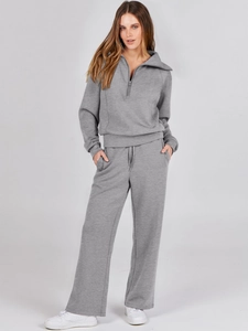 Two-piece lounge set featuring half-zip collar sweatshirt and wide-leg drawstring trousers