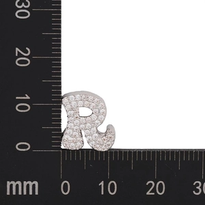 Macro shot of silver letter R charm with cubic zirconia pavé and size measurements