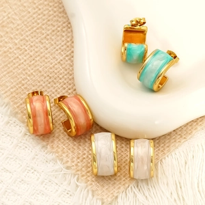 Three pairs of C-shaped gold stainless steel earrings with pink, blue, and white marble enamel