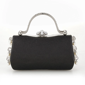 Elegant black velvet evening clutch bag with pearl floral clasp and silver chain strap