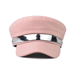 Pink beret hat featuring a wide silver metallic band and side buttons in macro detail