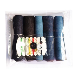 Detail of denim patch kit featuring 5 color rolls with sewing needles and buttons