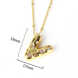 Detail of gold letter V pendant with sparkling crystals and 19mm size measurements
