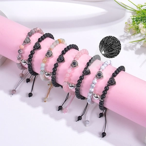 Magnetic couples bracelets with pink crystal beads and heart projection stone detail