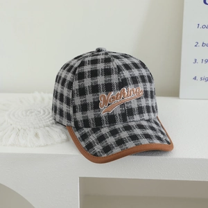 Detail of British style plaid baseball cap with Nothing embroidery and contrast brim edge