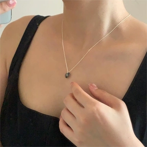Minimalist 925 sterling silver necklace featuring a dark Austrian crystal heart pendant