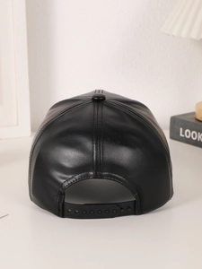 Close-up of the adjustable back strap and stitching on a black PU leather baseball cap
