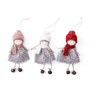 Handmade plush Christmas angel ornaments in pink, white, and red with bells and twine hangers