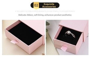 Pink drawer jewelry box with black velvet lining and silk ribbon handle for rings
