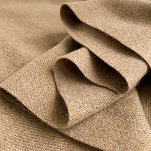 Minimalist solid color camel cashmere scarf with soft textured knit fabric