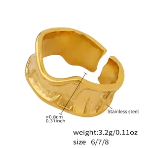 Detail of gold stainless steel ring featuring irregular hammered texture and 0.8cm band