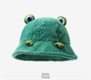 Detail view of plush green frog bucket hat with cute 3D eyes and paw embroidery