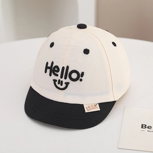 Detail of the high-quality Hello embroidery and contrast brim on this baby baseball cap