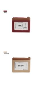 Close-up of red and beige RFID blocking card holders with crosshatch leather texture