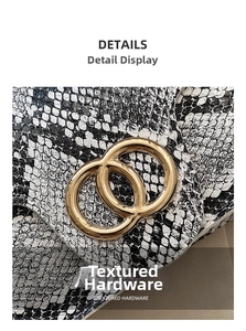 Close-up of gold double-ring hardware and snake-skin texture on a square crossbody bag