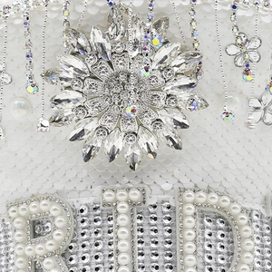 Sparkly white BRIDE captain hat with rhinestones, crystals, and pearl fringe for weddings