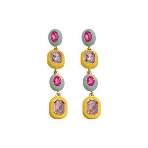 Vintage gold earrings with vertical emerald and yellow stones in a drop tassel design