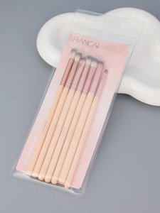 Detailed view of 8 RC fiber eye makeup brushes with pink handles and white-grey bristles