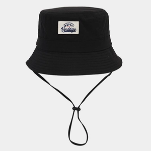 Detail of breathable black sun hat showing adjustable wind rope and mountain logo patch