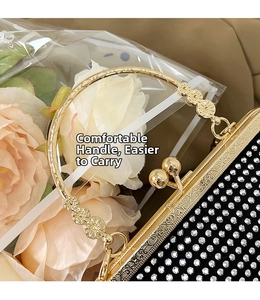 Macro detail of gold ring handle with embossed floral patterns on rhinestone clutch bag