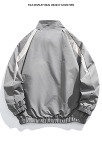 Detail view of the back of grey stand collar jacket with white reflective arc stitching