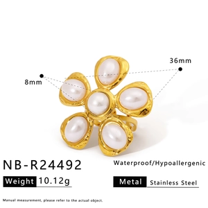 Detail view of gold stainless steel flower ring with pearl and waterproof specifications