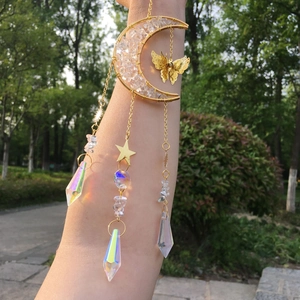 Detailed suncatcher with gold crescent moon and crystal prism reflecting rainbow light