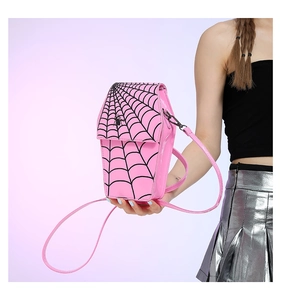 Pink coffin-shaped PU leather crossbody bag featuring a black spider web pattern and detail