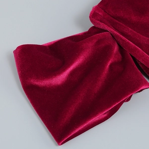 Detailed view of the luxurious deep red velvet fabric with soft texture and rich sheen