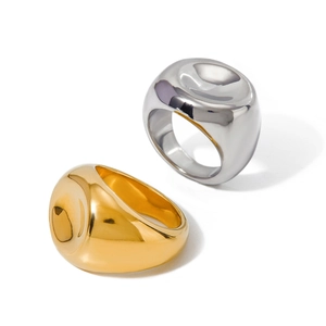 Polished 18k gold and silver chunky spiral stainless steel rings set on white background